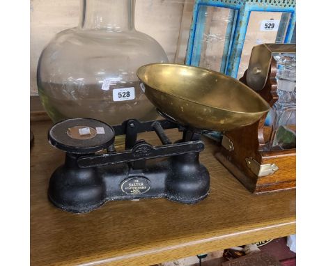A large glass vase and a set of Salter scales