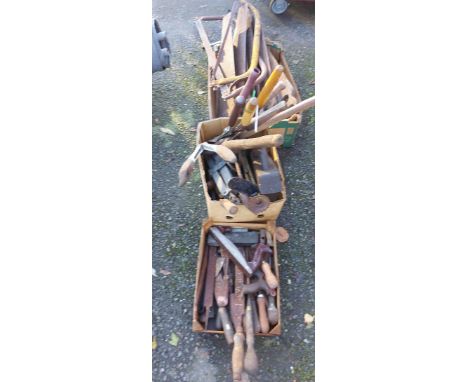 Three boxes containing a quantity of tools including old saws