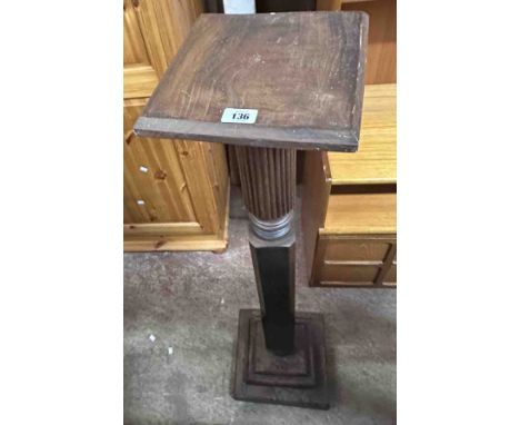 An antique mahogany torchère, set on reeded and chamfered pillar and stepped square base - from a tester bedpost
