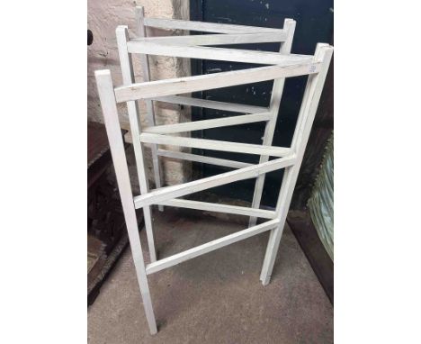 An 89cm white painted wood three shelf open plate rack - sold with a similarly painted folding clothes airer