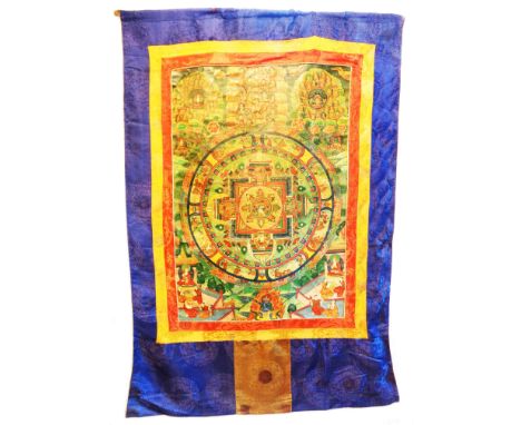 An old Nepalese Thangka Tibetan Buddhist wall hanging with highly detailed hand painted polychrome panel featuring a central 