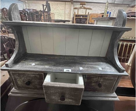 A 67cm modern shelf unit with three short drawers and distressed painted finish