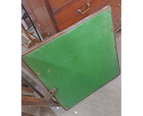 A folding card table with green baise top