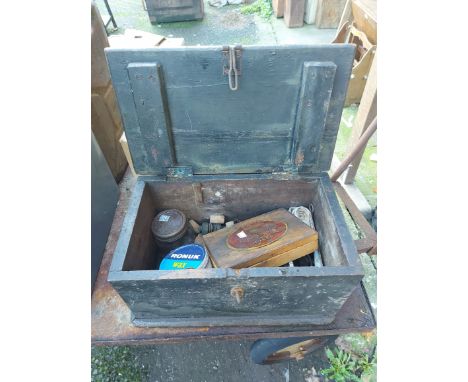 A small old wooden toolbox containing a quantity of corks, etc.