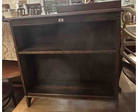 A 91cm vintage oak two shelf open bookcase, set on standard ends