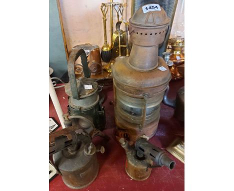 An old copper ship's lamp with glass lens - sold with an old military hand lantern with WD arrow mark for 1954 and two vintag