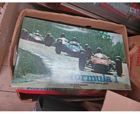 A box containing a quantity of toys and games including Formula One, Monopoly, diecast cars, etc.