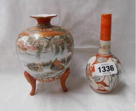 A Japanese Kutani porcelain vase of globe form with three elongated feet, decorated in iron red with panels, depicting figure