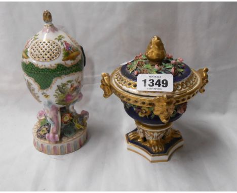 A 19th Century German porcelain lidded jar set on trefoil base with flower encrusted and hand painted panel decoration, depic