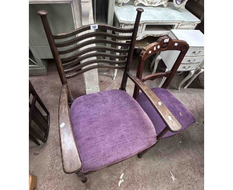 An Arts &amp; Crafts Movement oak framed elbow chair with wavy ladder back and purple velour upholstered seat, set on ring tu