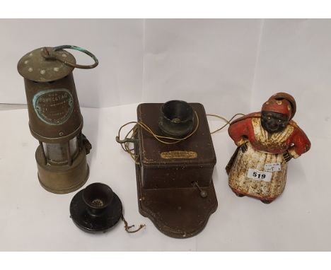 A novelty cast iron moneybox, a 'Protector' brass miner's lamp and an old wall telephone Notice from the the-saleroom.com: Th