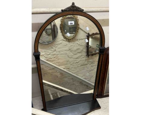 An Aesthetic Movement style ebonised and walnut strung hall mirror with arched plate and shelf under