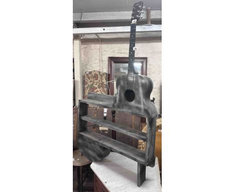 An 82cm novelty stained wood two shelf open bookcase with real half guitar top