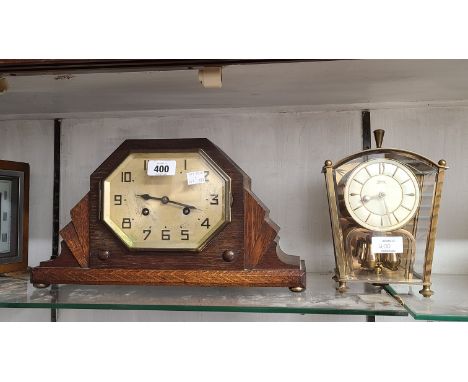 An Art Deco stained oak cased mantel clock with eight day gong striking movement - sold with a vintage Coma brassed metal and