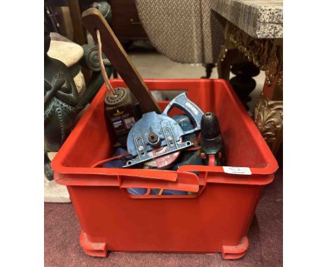 A red crate containing a quantity of tools - sold with a metal detector