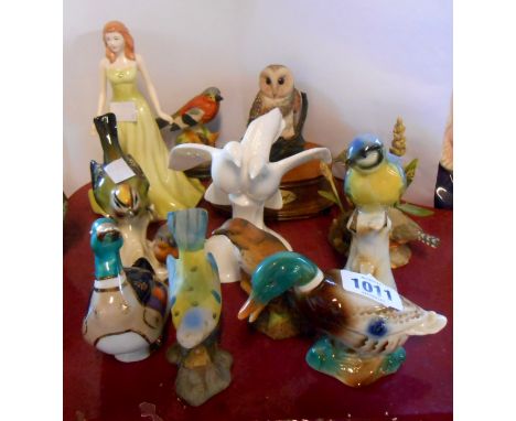 A quantity of bird and other figurines including Royal Doulton, Goebel, etc.