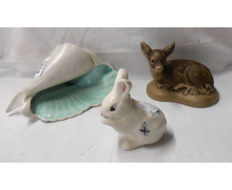 A Poole Pottery rabbit figurine with floral decoration on a white ground - sold with a Barbara Linley Adams fawn figurine and