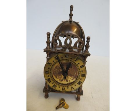 Brass 8 day lantern clock, made in great Britain currently ticking 