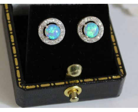 Pair of opal dress stud ear-rings stamped 925 Condition Report Click here for further images, condition, auction times & deli