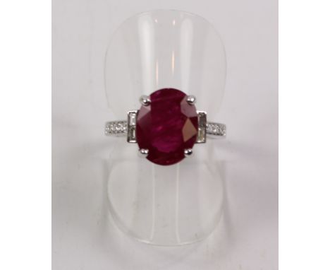Oval ruby and diamond ring hallmarked 18ct (ruby approx 3.5 carat) Condition Report Click here for further images, condition,