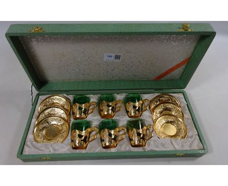Japanese coffee service, green glass cups with gilt dragon decorated metal holders and saucers in case Condition Report Click