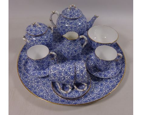 Royal Worcester cabaret set comprising of a tray, tea pot, sucrier, milk jug, slop bowl and four cups and saucers. dated 1879