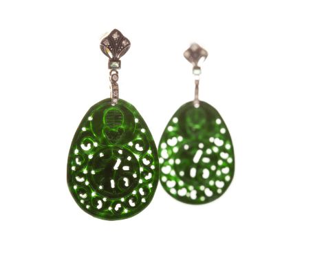 PAIR OF JADE AND DIAMOND EARRINGS, each formed by a flat carved and pierced panel of jade 34mm long, suspended from a gem and