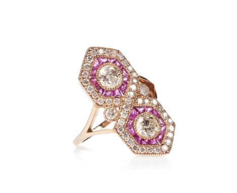 RUBY AND DIAMOND RING, the two round brilliant cut diamonds of approximately 0.30 carats each, surrounded by calibre cut rubi