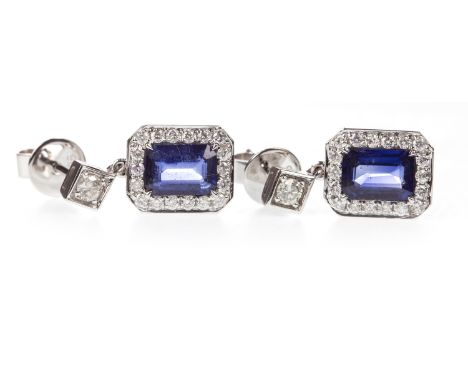 PAIR OF SAPPHIRE AND DIAMOND EARRINGS, the step cut sapphires within a diamond halo, suspended from a diamond set post, the r