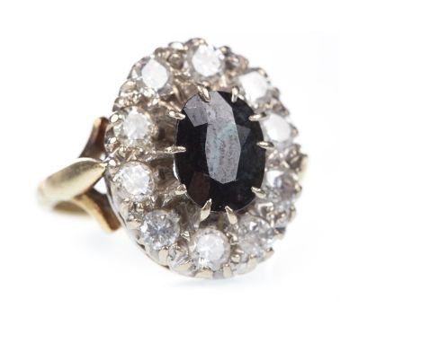 BLUE GEM SET AND DIAMOND CLUSTER RING, the oval blue gem within a round brilliant cut diamond halo, the diamonds totalling ap