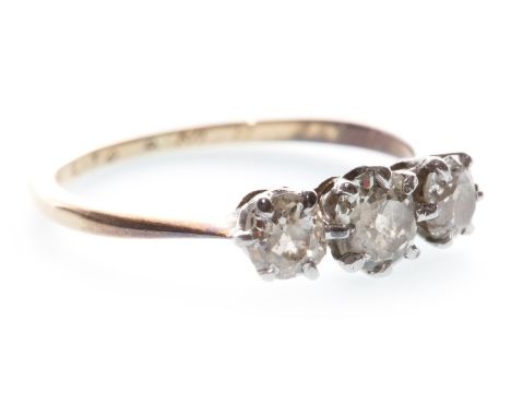 DIAMOND THREE STONE RING, set with graduated cushion cut diamonds totalling approximately 0.60 carats, marked 18, size M, 1.9