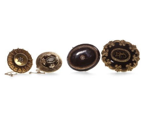VICTORIAN ENAMELLED MOURNING BROOCH, of overall oval form, with central monogrammed panel within a black enamel border, withi