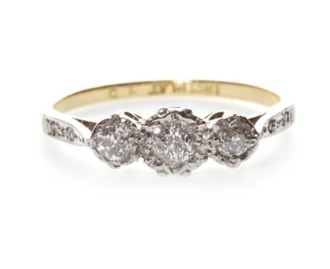 DIAMOND THREE STONE RING, mid twentieth century, with three illusion set diamonds totalling approximately 0.30 carats, marked