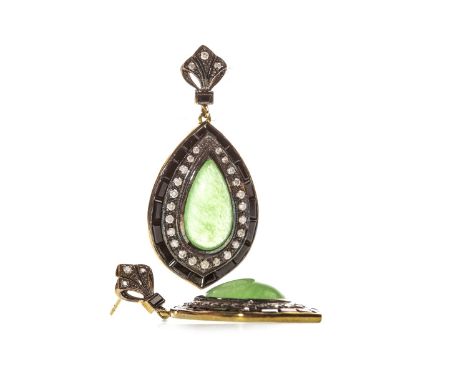 PAIR OF JADE, ONYX AND DIAMOND EARRINGS, each formed by a central pear shaped cabochon jade within a diamond border, in turn 