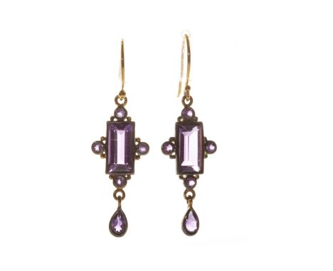 PAIR OF AMETHYST EARRINGS, ecah fomed by a central rectangular step cut amethyst 11mm long with a round amethyst to each side