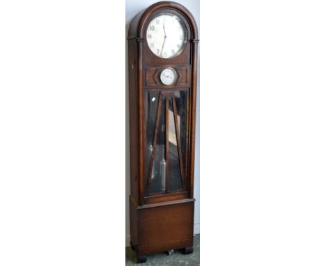 An Art Deco oak dome top longcase clock, Arabic numerals, inset barometer.