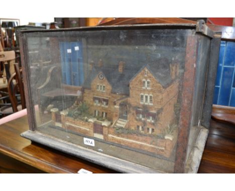 A late Victorian cork architectural diorama, the model as a substantial suburban villa, set in walled grounds, glazed case, 3