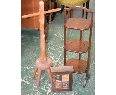 A 1950s cake stand; a vintage style key cabinet with 1920s type advertisement artwork to front; another (3) 