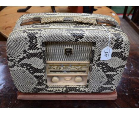 A vintage Ultra coronation Twin-de-Luxe portable valve radio, simulated snake skin patina, twin sliding door front, model R90