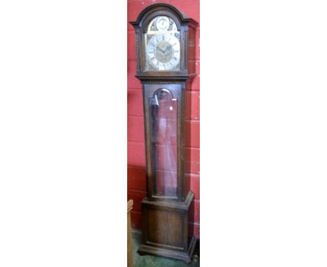 An oak cased longcase clock, arched face, brass spandrels, silvered chapter ring, Roman and Arabic numerals, three weights, (