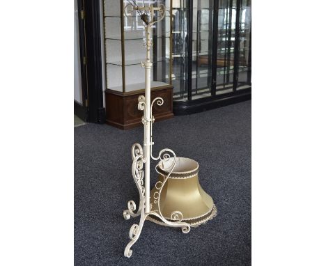 A wrought iron telescopic standard oil lamp converted for electricity.