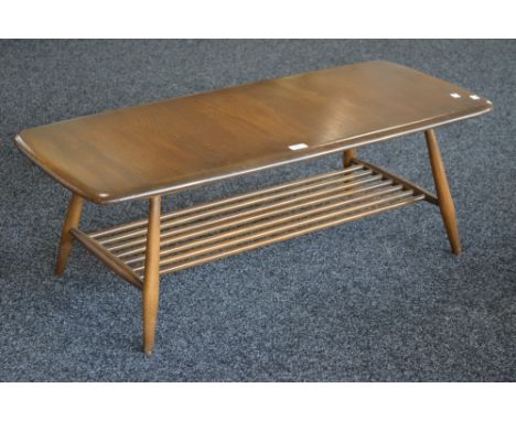 An Ercol coffee table, spindled undertier.