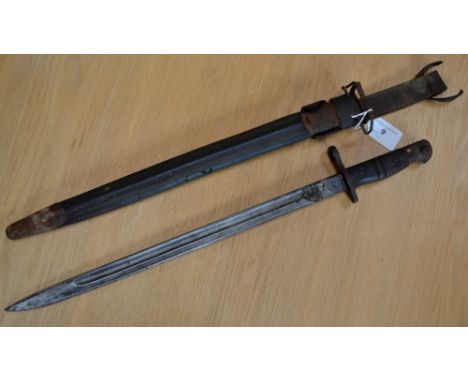 A Winchester M1917 bayonet stamped 1917 with US firebomb mark and eagle's head to the ricasso, ensuite scabbard.