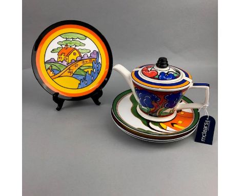 FOUR WEDGWOOD CABINET PLATES, in the manner of Clarice Cliff, along with a teapot (5)