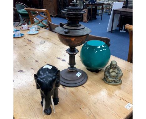 VICTORIAN COPPER OIL LAMP, 41cm high, along with a green glass shade, an early 20th century African carved wood elephant and 