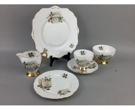 PART TEA SERVICE, decorated with roses, along with other tea ware