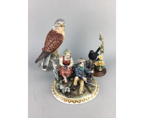 GOEBEL FIGURE OF A BIRD, 23cm high, along with a hand painted figure of a blackbird, a German figure group, a Franklin Mint v