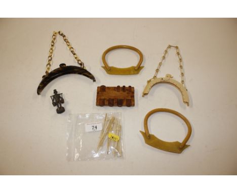 A 1930's tortoiseshell handbag mount, two other 1930's handbag mounts, a cribbage board marker, bone cocktail sticks etc.