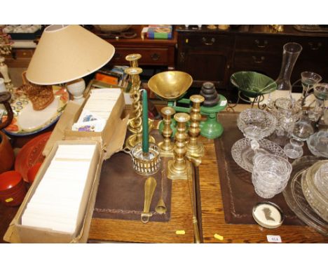 A pair of brass twist column candlesticks; a set of enamel and brass kitchen scales; various other candlesticks etc.