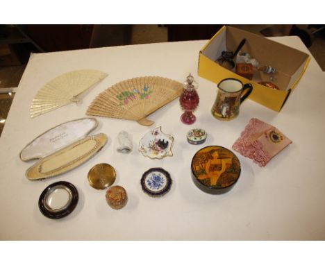 A box containing an amethyst coloured glass scent bottles, various compacts, fans etc